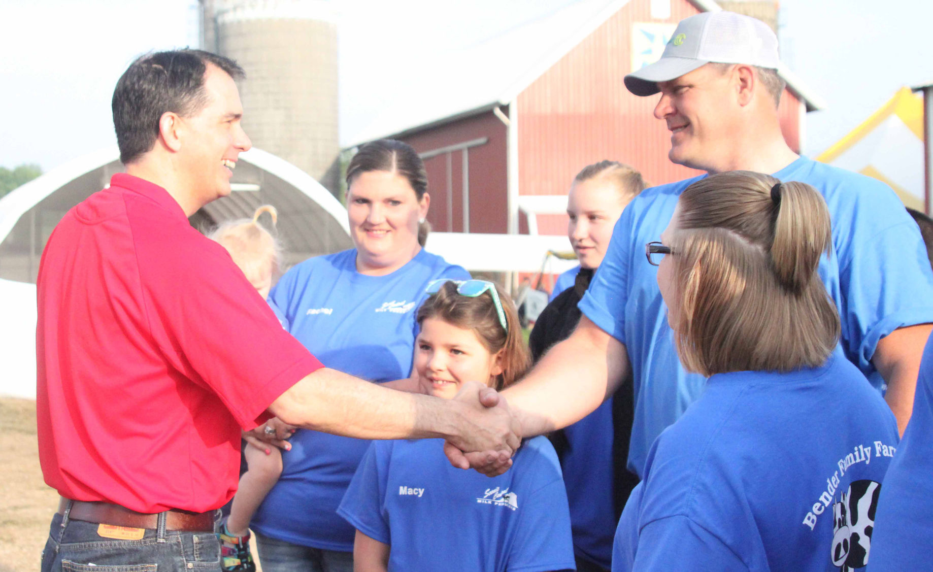 Govenor Walker shakes hands with Bender family (copy)